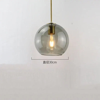 A sleek 30cm amber smoked gray decorbites glass ball led pendant light with brass fixture for dining room decor
