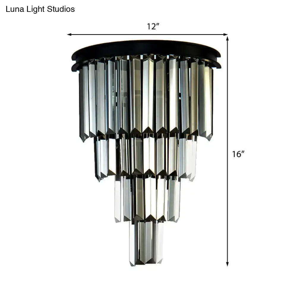 Modern amber tiered crystal wall mounted fixture with black finish and cascading clear amber glass prisms for living room