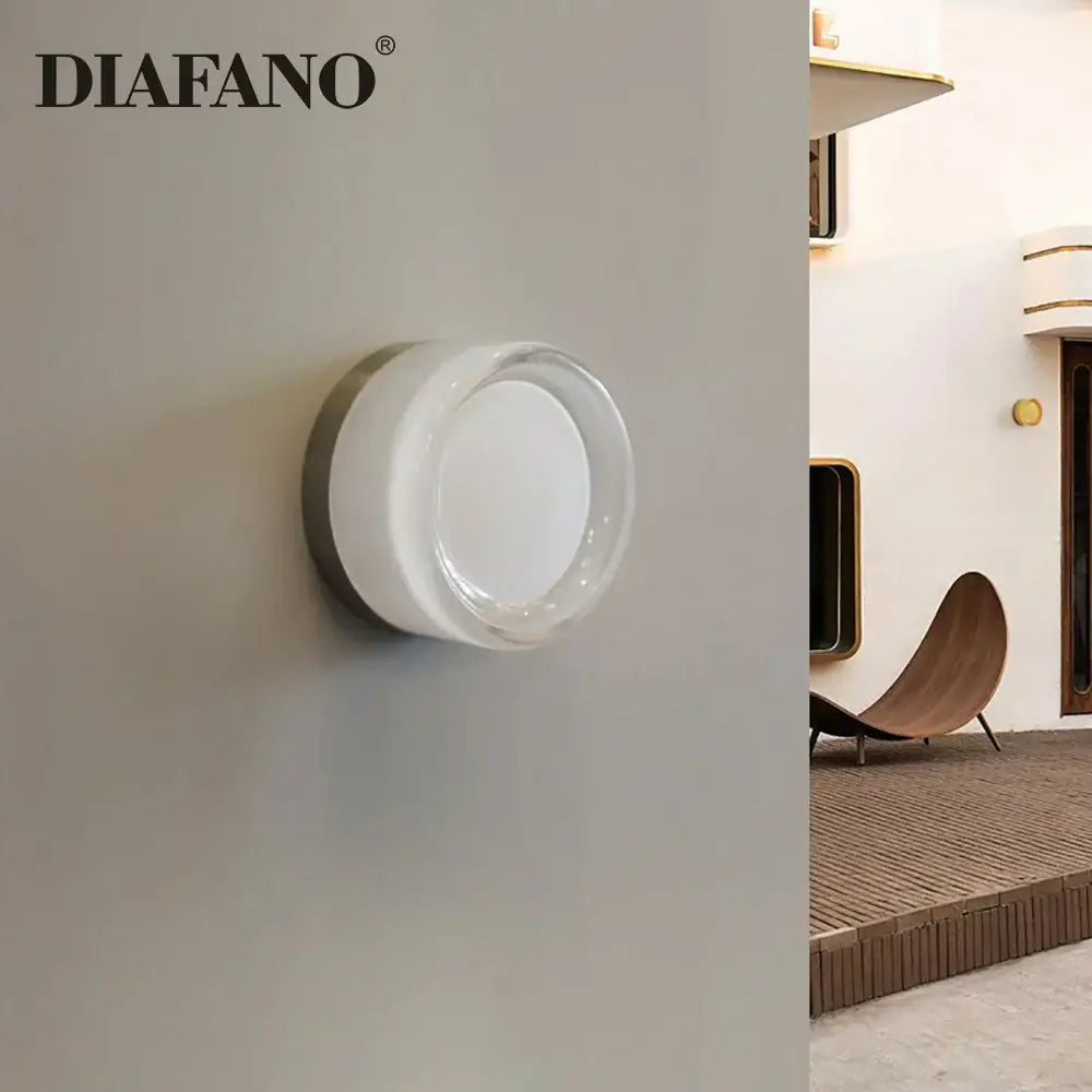 Modern amber and white glass sconce led wall lamp by diafano featuring clear glass and white ceramic for living room use