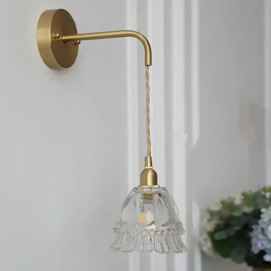 Modern antique brass amber glass led wall light featuring a delicate brass sconce with clear fluted amber glass shade and twisted cord