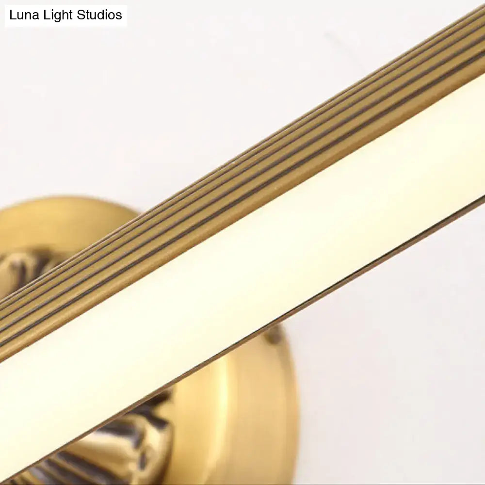 Modern antique brass integrated led wall light with brass finish and horizontal grooves for bathroom vanity use