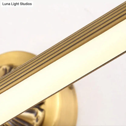 Modern antique brass integrated led wall light with brass finish and horizontal grooves for bathroom vanity use