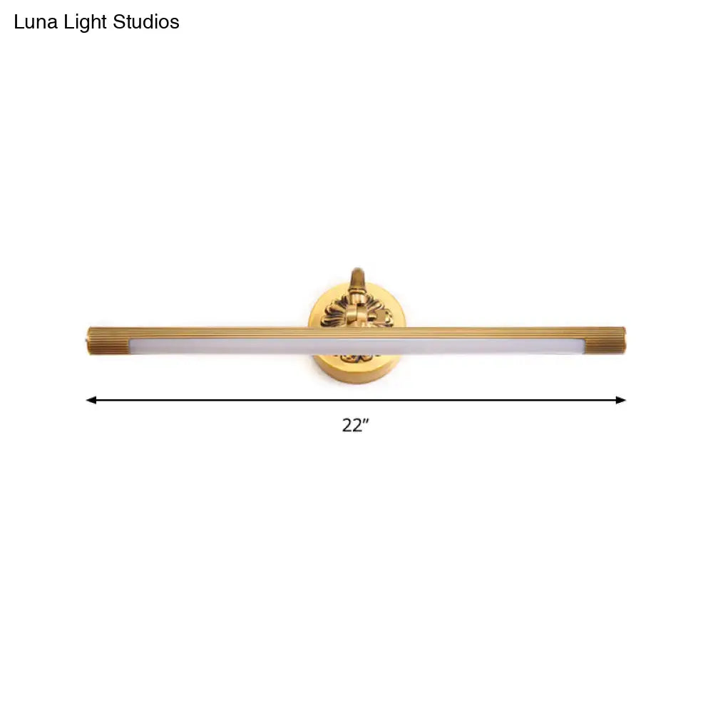 Modern antique brass integrated led wall light with gold finish and decorative circular base for bathroom vanity use