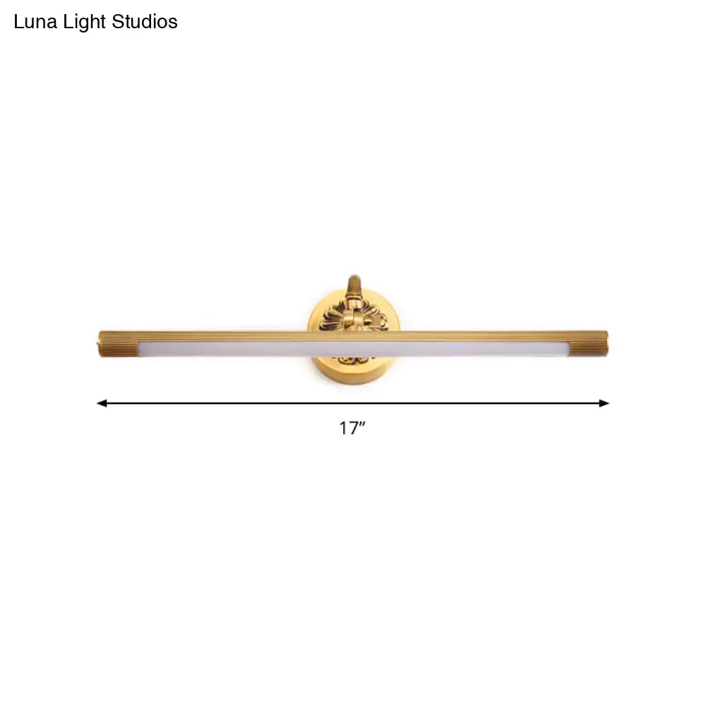 Modern antique brass integrated led wall light with gold finish and circular base for bathroom vanity lighting