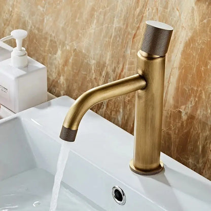Antique bronze single-handle bathroom faucet with textured knurled accents for cold water use