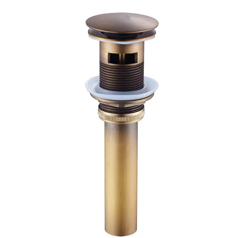 Antique bronze bathroom sink drain with a sleek cylindrical body and rounded top cap for cold water use