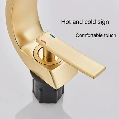 Modern arched brushed gold basin faucet bathroom mixer with sleek curved spout and rectangular handle with hot cold indicators