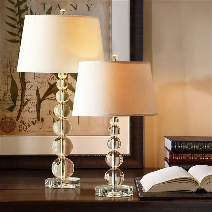 Two elegant crystal ball table lamps with stacked spherical bases and cream fabric shades by decorbites for bedroom decor