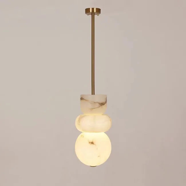 Modern pendant light with three stacked alabaster indoor ceiling orbs made of spanish marble and brass rod suspension