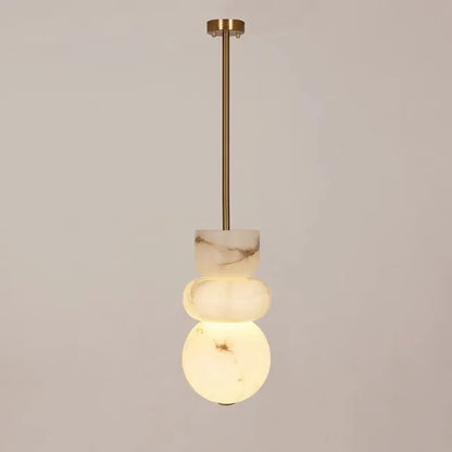 Modern pendant light with three stacked alabaster indoor ceiling orbs made of spanish marble and brass rod suspension