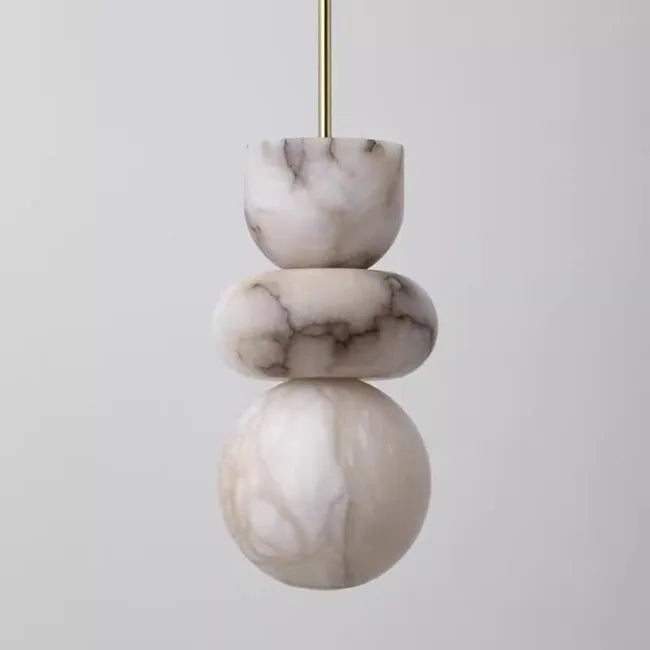 Modern pendant light with three stacked alabaster indoor ceiling discs in spanish marble veined pattern and brass rod suspension