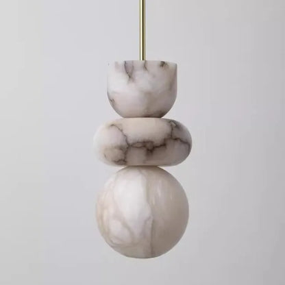 Modern pendant light with three stacked alabaster indoor ceiling discs in spanish marble veined pattern and brass rod suspension