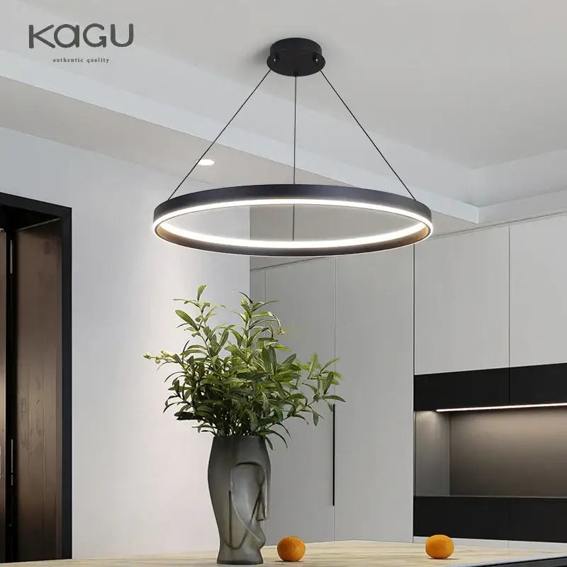 Modern artistic black chandelier featuring a sleek circular led pendant light with warm glow for living room decorbites artistic black