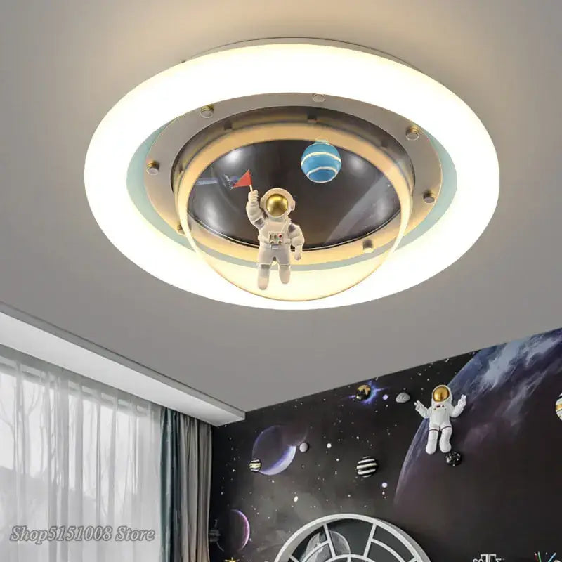 Circular ceiling lamp with a white astronaut spaceman figurine inside frosted glass rings for kids bedroom light