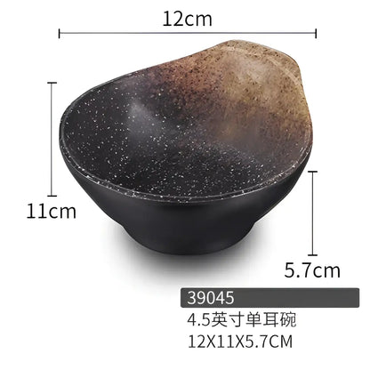 Modern asymmetrical black melamine plastic dipping sauce bowl with speckled black and brown ceramic glaze finish 12cm wide