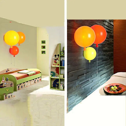 Modern balloon wall light featuring yellow orange and red balloons as decorative bedroom wall light fixtures