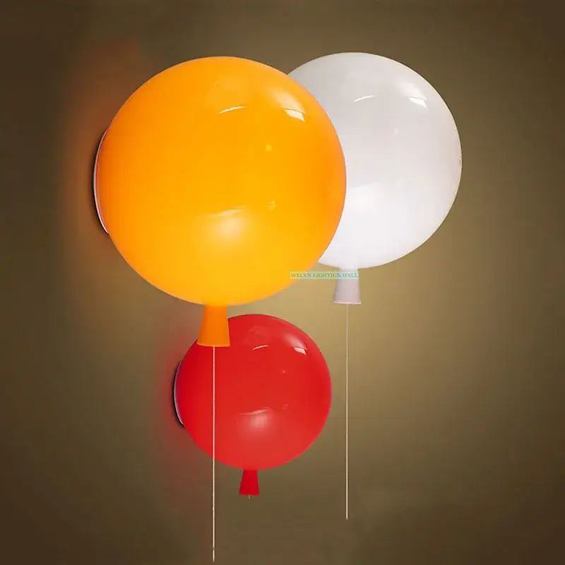 Modern balloon wall light featuring vibrant orange white and red balloon-shaped glossy plastic sconces for bedrooms
