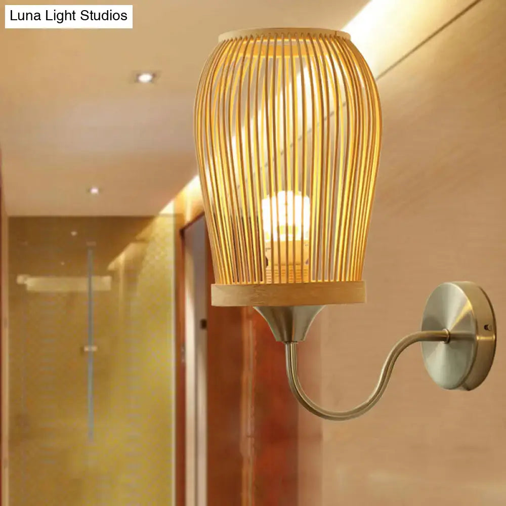 Modern bamboo cage wall sconce featuring warm-toned bamboo and a sleek metal gooseneck arm wall lamp for bedroom use