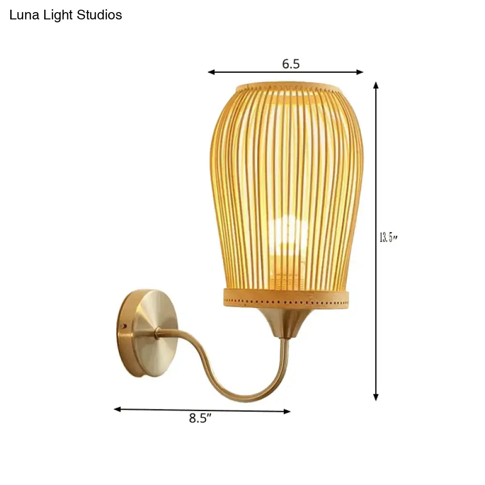 Modern bamboo cage wall lamp with warm-toned ribbed bamboo shade and brass-finished metal gooseneck arm for bedroom use