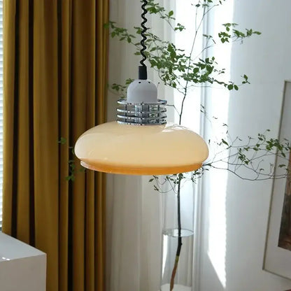 Modern bauhaus cream glass led chandelier featuring a warm amber glass led pendant light with chrome collar and black cord