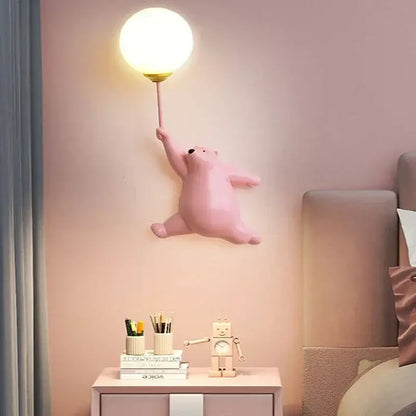 Modern pink bear moon wall lamp with golden base and glowing spherical bulb for kids bedroom decor