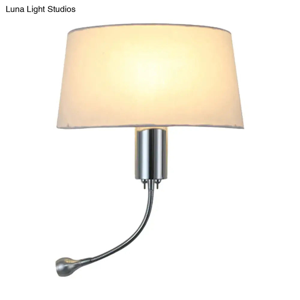 Cream-colored fabric lampshade with a sleek chrome-finished metal base and flexible gooseneck arm.