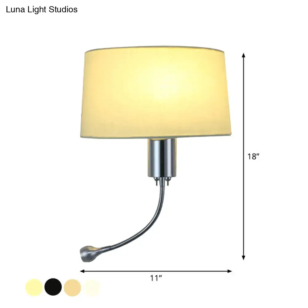 A sleek, 18-inch wall-mounted lamp with a brushed chrome finish and an adjustable gooseneck arm supporting a soft beige fabric shade.