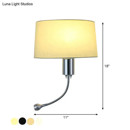 A sleek, 18-inch wall-mounted lamp with a brushed chrome finish and an adjustable gooseneck arm supporting a soft beige fabric shade.