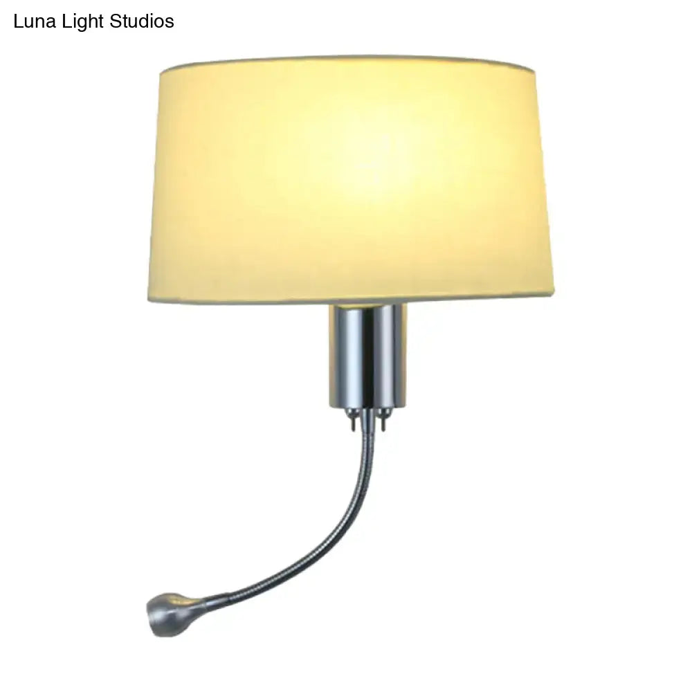 A modern beige fabric flush wall sconce with a cream shade and chrome finish, ideal as a bedroom reading light