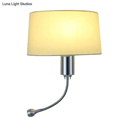 A modern beige fabric flush wall sconce with a cream shade and chrome finish, ideal as a bedroom reading light