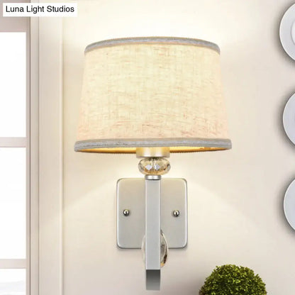 Modern beige fabric wall sconce with crystal accent and polished chrome trim for direct wired electric e26 e27 bulb use