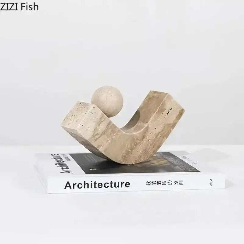Modern beige geometric stone sculpture with curved angular base and smooth spherical top for desk decoration decorbites geometric stone