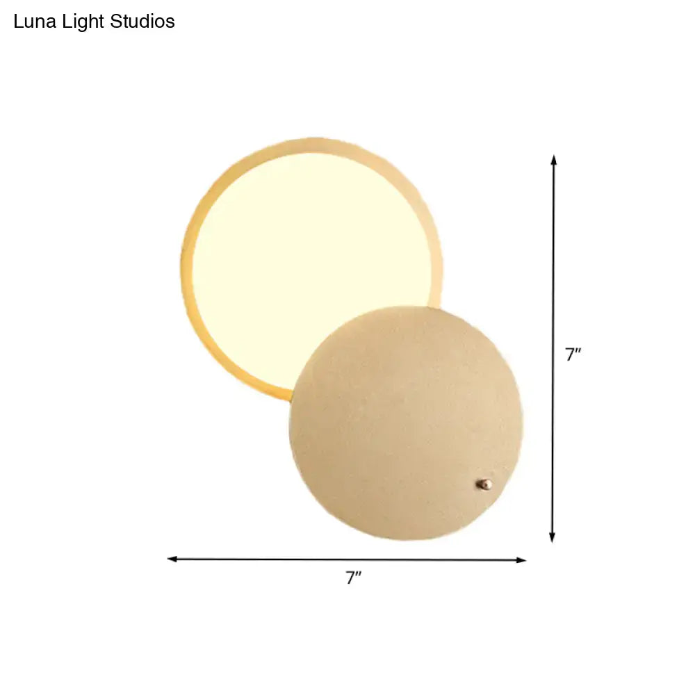 Modern beige and gold metal rotatable led wall lamp with circular design and warm diffused glow for bedroom use
