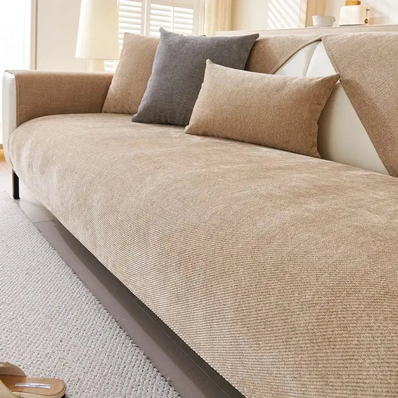 Modern beige chenille sofa cover with subtle ribbed corduroy texture and matching throw pillows for living room use