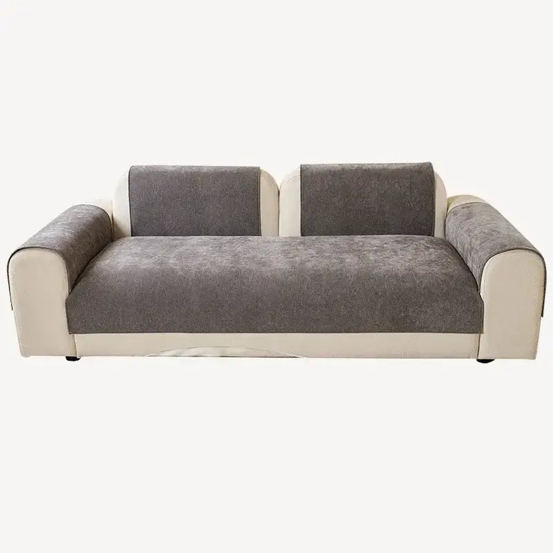Modern two-seater sofa with gray textured fabric and white leather-like armrests, featuring a beige and gray chenille cover