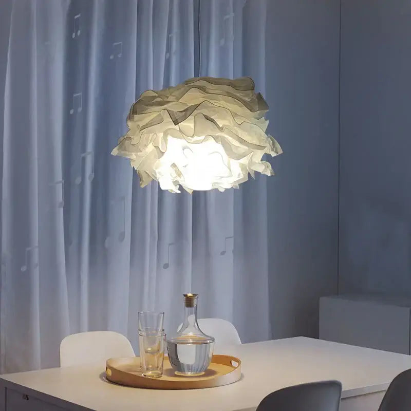 A soft cream-colored nordic paper pendant light with a ruffled design from decorbites for living room decor