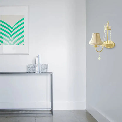 Modern beige ornate crystal sconce with gold-toned wall fixture cream lampshade and dangling beads 15 inch fixture