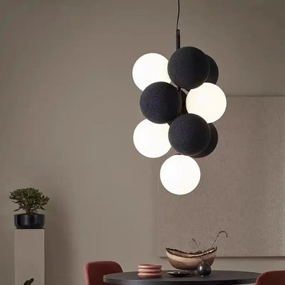 Modern black and white spherical pendant lamp with textured matte finish for dining room decorbites abstracta pendant