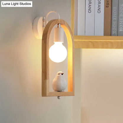 Modern beige wooden arched wall lamp with ceramic bird decor and power source, measuring nine inches for bedroom use
