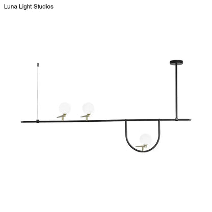 Modern black 3 head kitchen island light with opal glass shade featuring three frosted glass globe shades