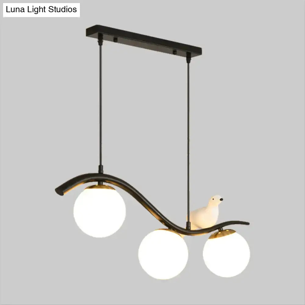 Decorbites modern black metal pendant light with three clear white ball shade bulbs and ceramic pigeon decor