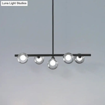 Modern black metal chandelier with five clear glass globe bulbs for dining room pendant lighting