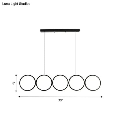 Black minimalist metal pendant light with five circular rings for decor bites hanging island light over table