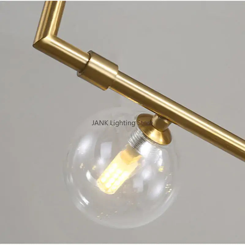 Modern black 7 light glass shade pendant light with brass finish and clear globe glass shade pendant for dining room