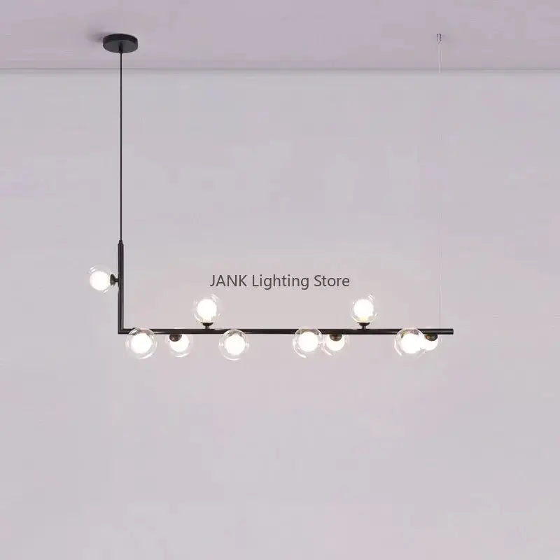 Modern black pendant light with seven clear glass shade globes in a linear design for dining room lighting
