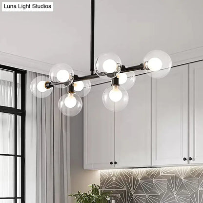 Modern black 8-head kitchen chandelier featuring a light kit with clear glass shade and clear glass globe bulbs
