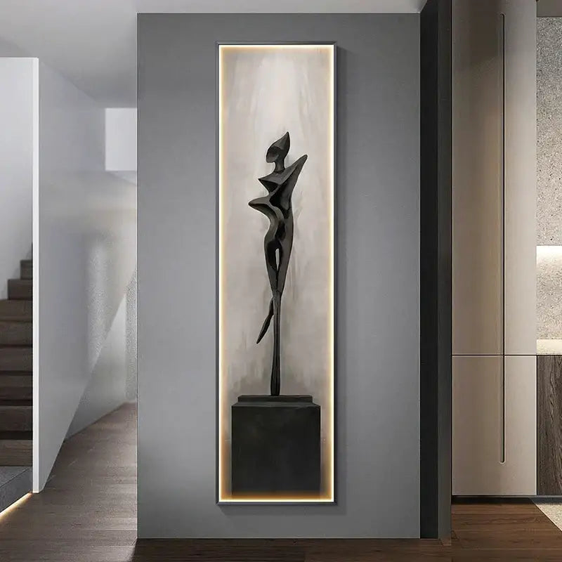 Modern black abstract art led wall lamp featuring a stylized human figure sculpture in an illuminated niche for decorbites decor