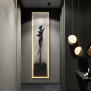 A sleek black abstract art led wall lamp featuring a stylized human figure sculpture for modern living room decor