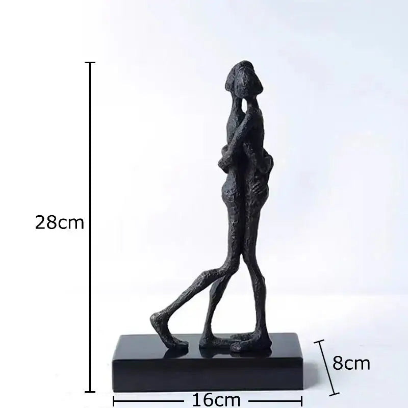 Black abstract lovers sculpture desk ornament featuring two embracing figures on a rectangular base for bedroom decor