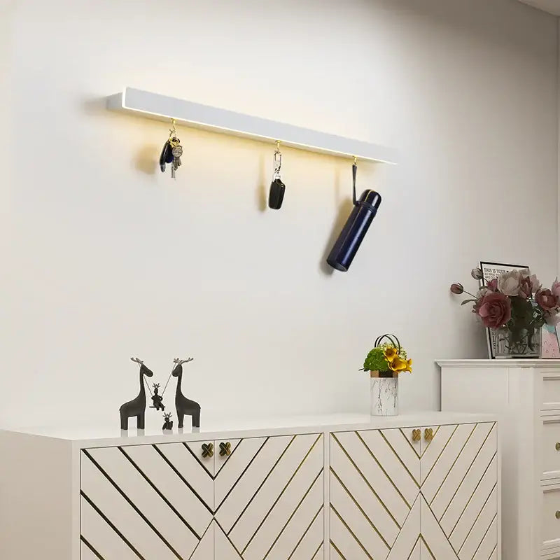 Modern black acrylic led wall lamp with integrated lighting and three hooks for keys and umbrella decorbites acrylic led wall